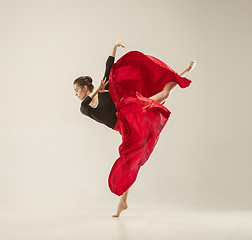 Image showing Modern ballet dancer dancing in full body on white studio background.