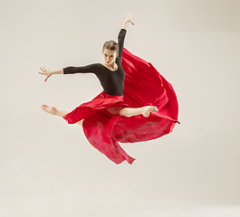 Image showing Modern ballet dancer dancing in full body on white studio background.