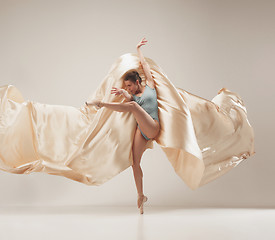 Image showing Modern ballet dancer dancing in full body on white studio background.