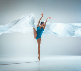 Image showing Modern ballet dancer dancing in full body on white studio background.