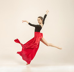 Image showing Modern ballet dancer dancing in full body on white studio background.