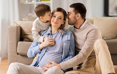 Image showing happy family with pregnant mother at home