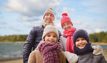 Image showing happy family over autumn beach background