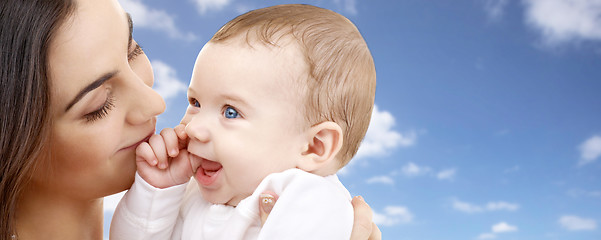 Image showing mother with baby over sky background