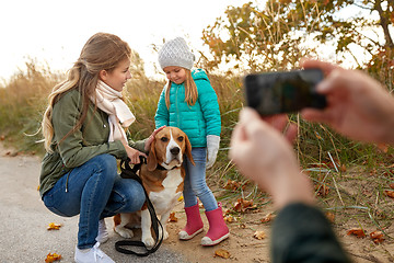 Image showing family photographing by smartphone on autumn beach