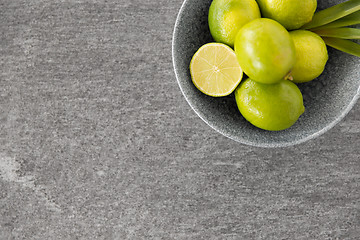 Image showing close up of whole limes in bowl