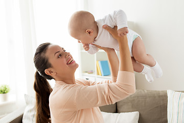 Image showing happy mother playing with little baby boy at home