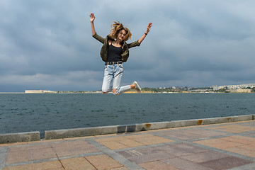 Image showing A young girl taken in a jump