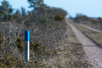 Image showing Way marker by an unfocused dirt road