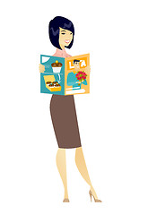 Image showing Successful asian business woman reading magazine.