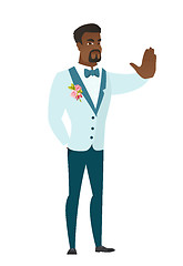 Image showing African-american groom showing stop hand gesture.