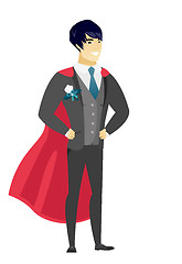 Image showing Groom wearing a red superhero cloak.