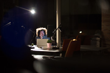 Image showing businessman relaxing at the desk