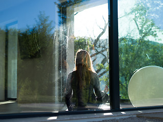 Image showing young woman doing morning yoga exercises