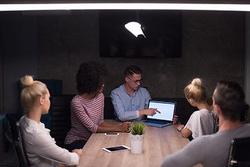 Image showing Multiethnic startup business team in night office