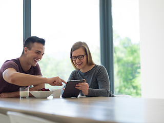 Image showing couple enjoying morning coffee and strawberries