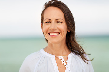 Image showing happy smiling woman on summer beach