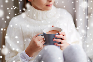 Image showing close up of girl in winter sweater with cacao mug