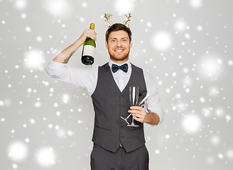 Image showing man with bottle of champagne at christmas party