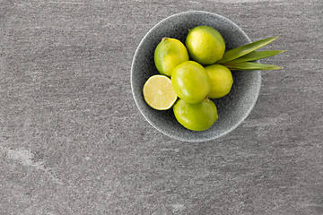 Image showing close up of whole limes in bowl