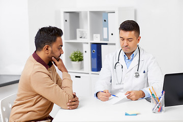 Image showing doctor showing prescription to patient at clinic