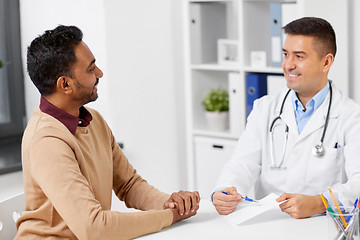 Image showing doctor showing prescription to patient at clinic