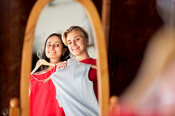 Image showing women choosing clothes at vintage clothing store