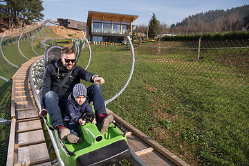 Image showing father and son enjoys driving on alpine coaster