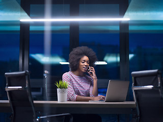 Image showing black businesswoman using a laptop in startup office