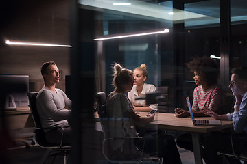 Image showing Multiethnic startup business team in night office