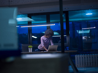 Image showing black businesswoman using a laptop in startup office