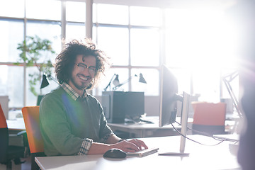 Image showing businessman working using a computer in startup office