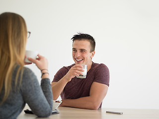 Image showing couple enjoying morning coffee and strawberries