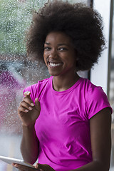 Image showing african american woman using tablet