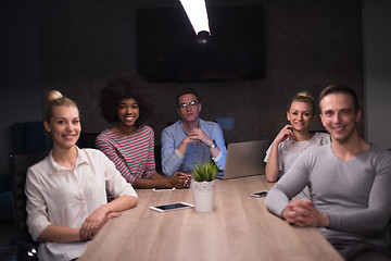 Image showing Multiethnic startup business team in night office