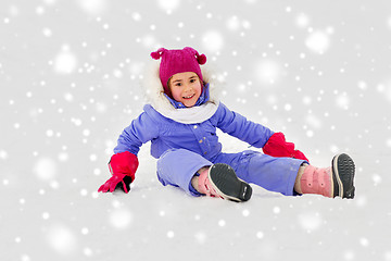 Image showing happy little girl in winter clothes outdoors