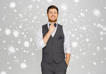 Image showing happy man in festive suit dressing for party