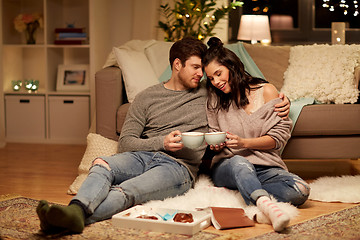 Image showing happy couple drinking cacao at home