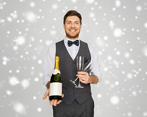 Image showing man with bottle of champagne and glasses at party