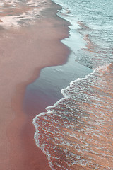 Image showing Calm waves running over sand coast