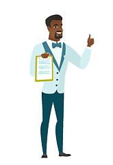 Image showing Groom with clipboard giving thumb up.