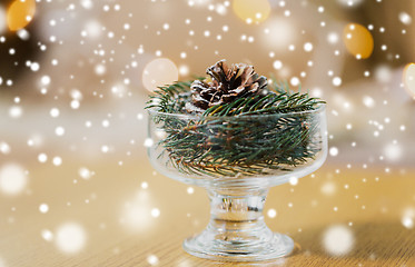 Image showing christmas fir decoration with cone in dessert bowl