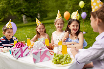 Image showing happy kids on birthday party at summer garden