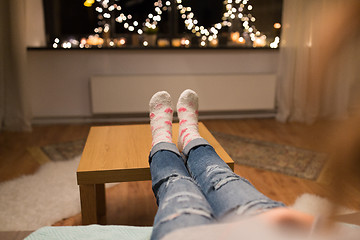 Image showing close up of female feet at home on christmas