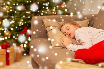 Image showing girl sleeping on sofa at christmas