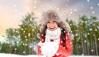 Image showing woman in fur hat with snow over winter forest