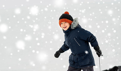 Image showing happy little boy with sled in winter outdoors