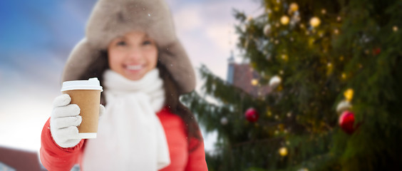 Image showing woman with coffee over christmas tree in tallinn