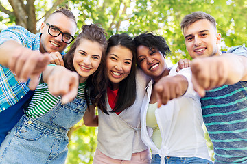 Image showing happy international friends hugging in park