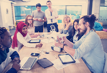 Image showing multiethnic business team learning about drone technology